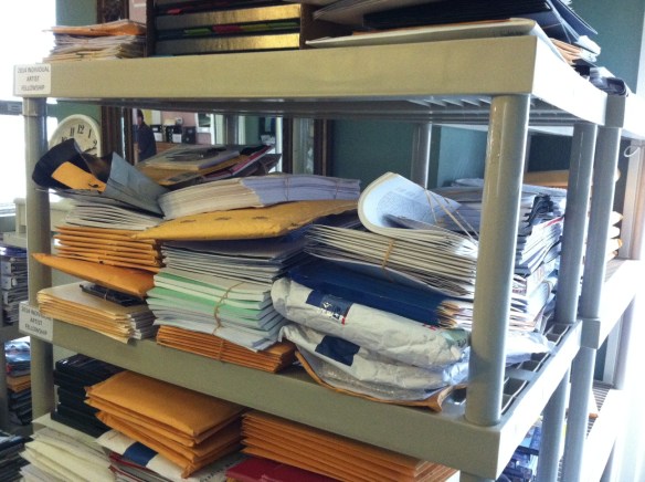 Our file room is filled with stacks of support materials that were mailed in as part of applications.